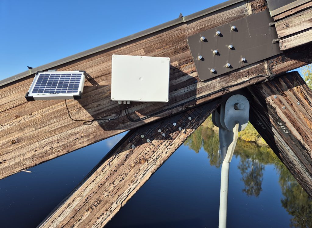 Installation of wooden bridge with solar cell